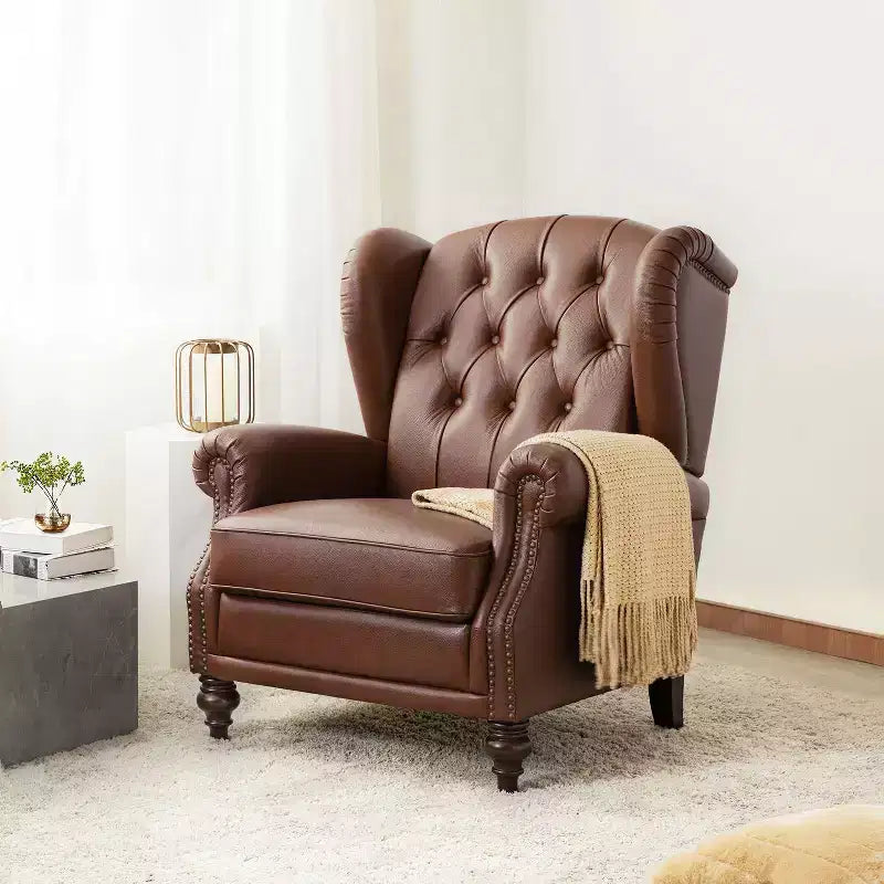 Poltrona Wingback monoposto in vera pelle nera / marrone / bordeaux / cammello / blu navy, con borchie decorative