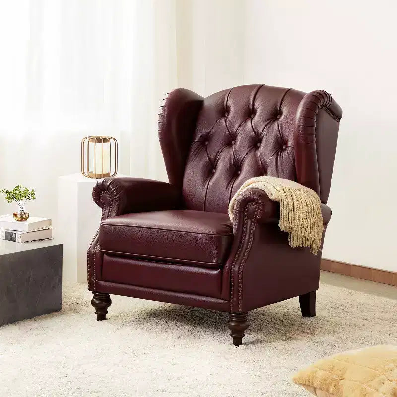 Poltrona Wingback monoposto in vera pelle nera / marrone / bordeaux / cammello / blu navy, con borchie decorative