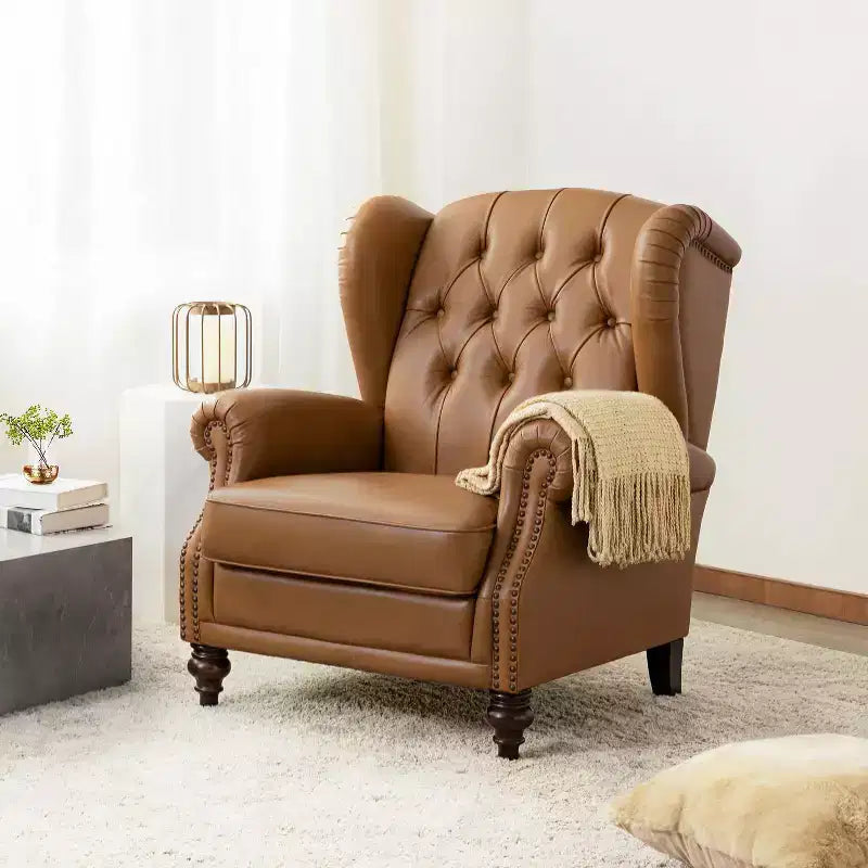 Poltrona Wingback monoposto in vera pelle nera / marrone / bordeaux / cammello / blu navy, con borchie decorative